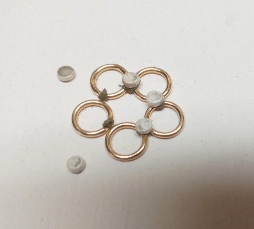 Judy Larson's Five Golden Rings Earrings - , Holiday Designs, Butane Torch, Soldering, Solder, Press a flattened dot from Step 2 into the solder squishing up between the rings